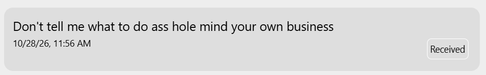 Text message reading: Don't tell me what to do ass hole mind your own business. Timestamp 10/28/26, 11:56 AM. Status Received.